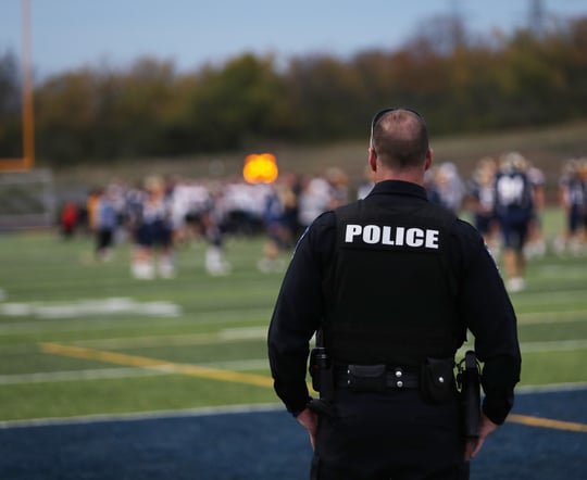 Police Officer Using Incident Command at a Football Stadium